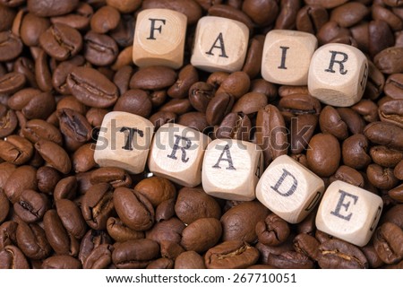 coffee beans with the word fair trade / Fair Trade