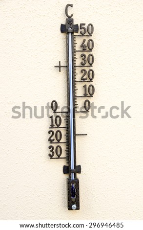 Outdoor Thermometer on a yellow background / Thermometer