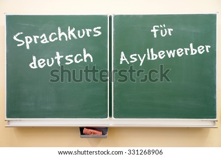 Sign with the german words German language course for asylum seekers / German language course