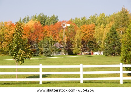 Country estate surrounded by trees in autumn