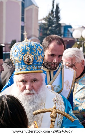 STRUGA, MACEDONIA - JANUARY 19, 2012: An orthodox priest during the Epiphany (Vodici, Bogojavlenje, commemoration of Saint John the Baptist) in Struga, Macedonia