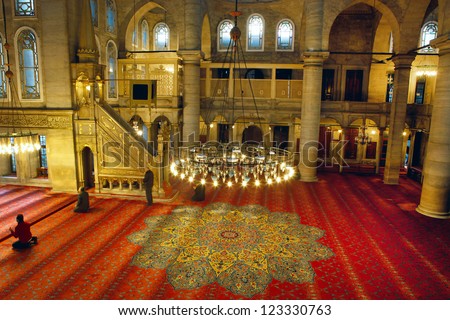 ISTANBUL,TURKEY-DEC 26: Muslims pray inside of Eyup Sultan Mosque on Dec 26,2012 in Istanbul,Turkey. Eyup Sultan is the first mosque constructed by the Ottoman Turks in the city.