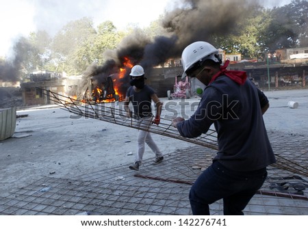 ISTANBUL,TURKEY-JUNE 11:Police attack Taksim protesters with tear gas and water cannons on june 11, 2013 in Istanbul,Turkey.Clashes continued all day between police and demonstrators.