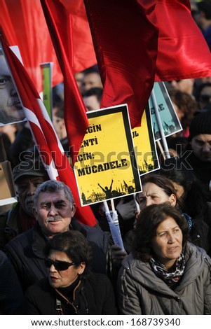 ISTANBUL,TURKEY-DECEMBER 22:Thousands protest against corruption and government on 22 December, 2013 in Istanbul, Turkey. Aprotester holds a placard that reads\