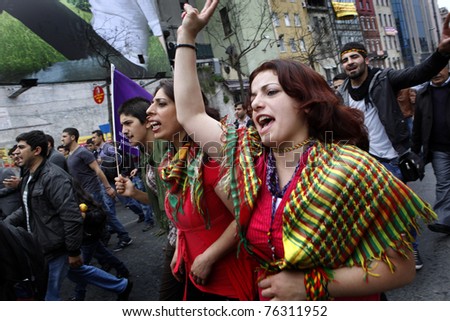 ISTANBUL-MAY 1: An unidentified woman shouts slogans at a May Day rally on May 1, 2011 in Istanbul's Taksim Square in Istanbul,Turkey. The event attracted thousands of labor protesters.