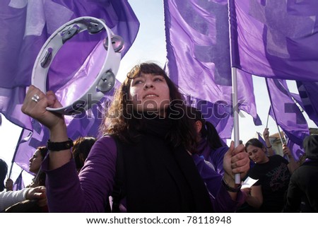 ISTANBUL,TURKEY-MARCH 8:Unidentified woman in purple costume celebrates International Women\'s Day on March 8,2008 in Istanbul,Turkey.