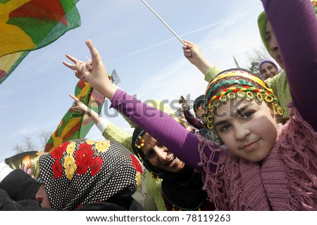 ISTANBUL,TURKEY-MARCH 8:Unidentified girl in traditional costume celebrates International Women\'s Day on March 8,2008 in Istanbul,Turkey.