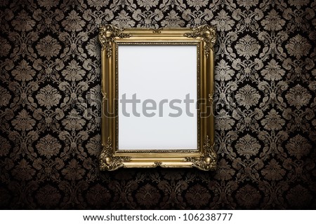 Ornate gold frame at grunge wallpaper with clipping path