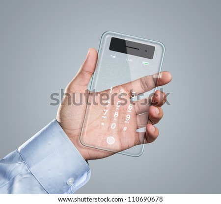 Male hand holding futuristic transparent mobile smart phone with copy space