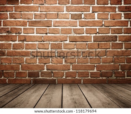 Grunge empty interior with brick wall and wooden floor with copy space