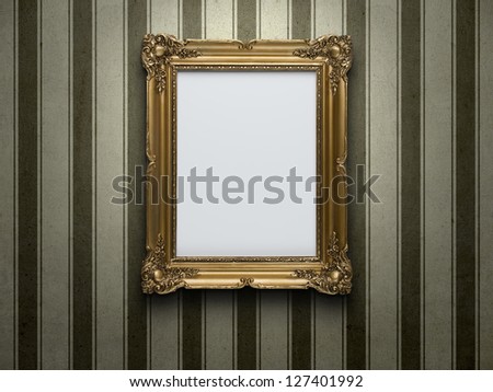 Blank gold picture frame at grunge striped wall with copy space