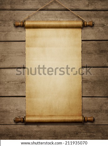 Old grunge blank paper scroll on the wooden wall with copy space