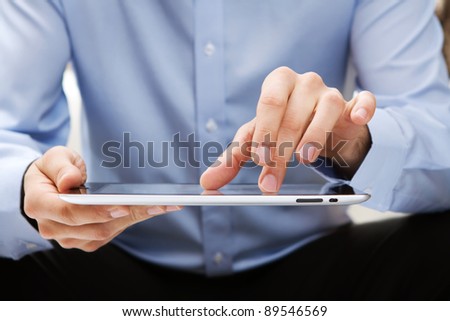 Young adult working on a digital tablet