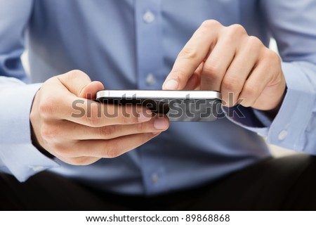 Young adult using mobile smart phone