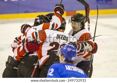 GRANADA, SPAIN - FEBRUARY 3, 2015: match of ice hockey of the Winter Universiade 2015 faced off Kazakhstan and Japan. Japanese team celebrating a goal.