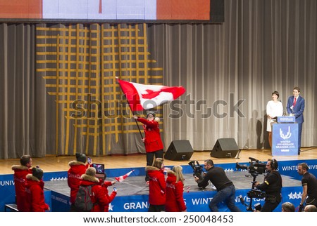 GRANADA, SPAIN - FEBRUARY 4, 2015: opening ceremony of the Winter Universiade 2015, Granada. Flag Bearer and Canadian team during the ceremony Flag Bearer and Canadian team during the ceremony.
