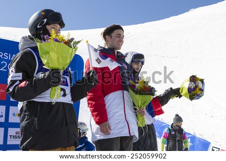 GRANADA, SPAIN - FEBRUARY 11, 2015: Winter Universiade 2015. Men\'s Ski Halfpipe Final. Victory Lane, LEONARD John, USA, gold, KIM Kwang-Jin, Korea, silver, and CHUPA Pavel, bronze.
