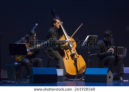 GRANADA - SPAIN, MARCH 10, 2015: XXVII International Tango Festival of Granada.\
Tangu Project, Mariano Gonzalez, bandoneon, Nicolas Leguizamon, guitar, and Juan Baca, bass.