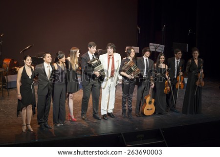 GRANADA - SPAIN, MARCH 14, 2015: XXVII International Tango Festival. Carlos Habiague Group, Cristian Figueroa and Evangelina Latigano, dancer.