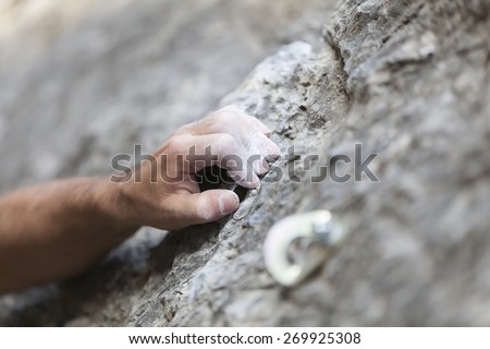 detail of the hand of a climber