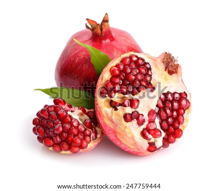 Pomegranates juice with fruit isolated on white background