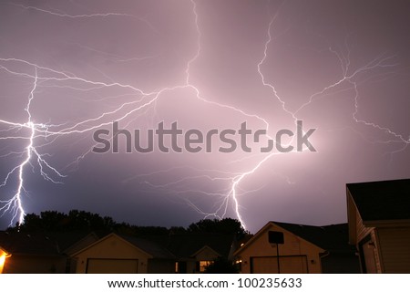 large lightning strikes filling sky