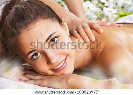 Girl getting a body massage at the day spa