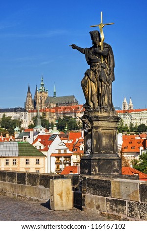 St. John the Baptist, view of the Cathedral of St. Vitus. Charles Bridge in Prague.