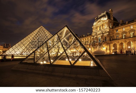 Paris - September 25: Louvre Museum At Night On September 25,2013. Louvre Museum Is One Of The World\'S Largest Museums With More Than 8 Million Visitors Each Year.