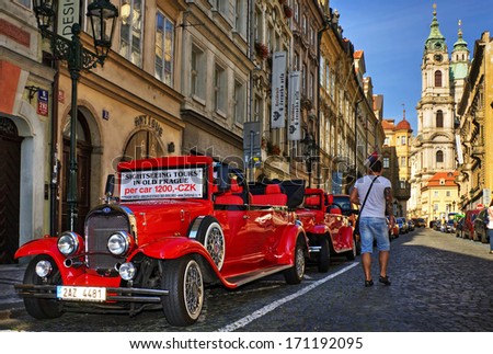 PRAGUE - SEPTEMBER 10: Sightseeing tours on vintage car in old prague on September 10, 2012 in Prague, Czech Republic.