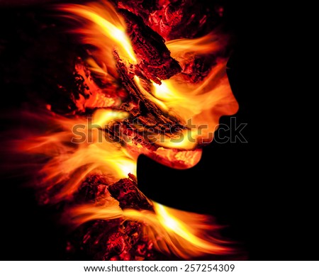 Double exposure portrait of young woman and fire.