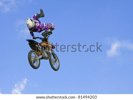 MOSCOW - JULY 9: Ivan Zucconi\'s demo jump on the bike. Freestyle Motocross. Motorcycle Jumping on the Red Square on July 9, 2011, Moscow. Red Bull X-Fighters