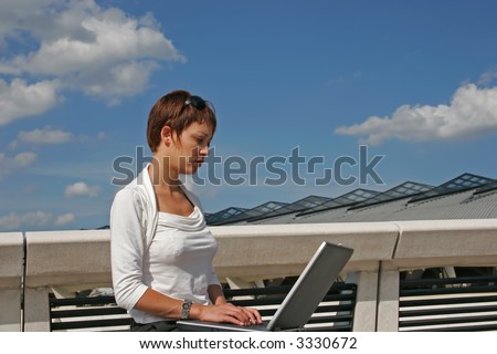Woman working on her portable computer