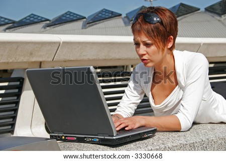 Woman working on her portable computer
