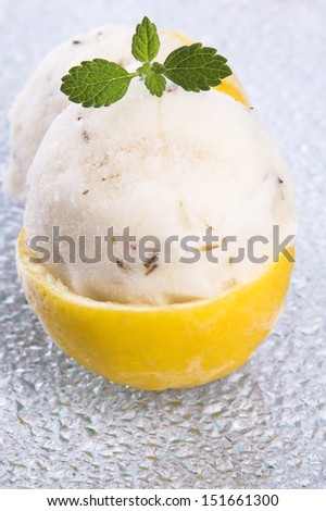 lemon sorbet with lavender in cups of lemon