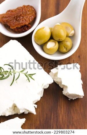 Feta cheese with olives, sun dried tomatoes and fresh herbs
