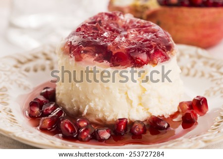 coconut panna cotta dessert with pomegranate