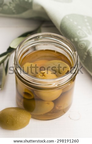 pickled olives and olive tree branch