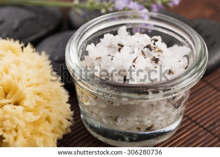 Homemade skin exfoliant (skin scrub) of sea salt, olive oil and lavender flowers