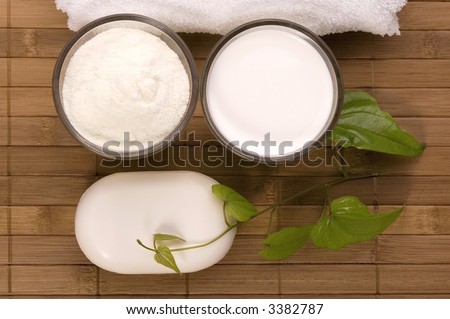 milk bath items. soap, milk, towel. white therapy