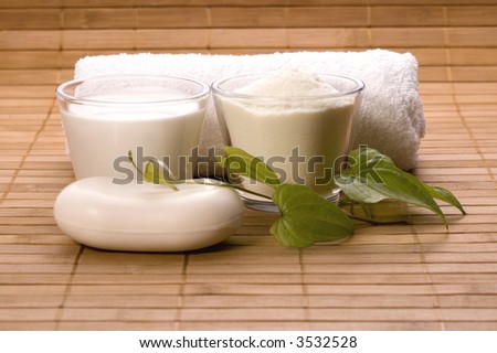 milk bath items. soap, milk, towel. white therapy
