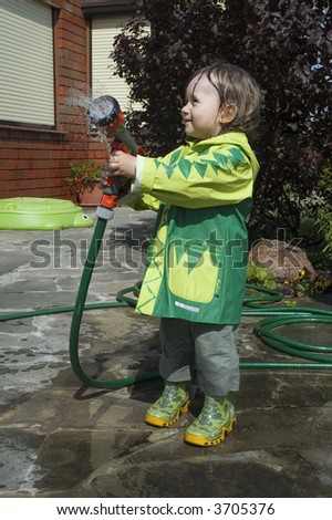 girl watering the garden. water fight
