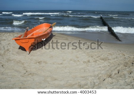 summer scenic. sand, water, sky and boat