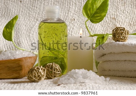 aroma therapy objects. bottle of esential aroma liquid, candle, towels, bath - salt