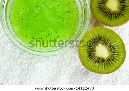 fruit therapy items. kiwi, towels, and facial mask