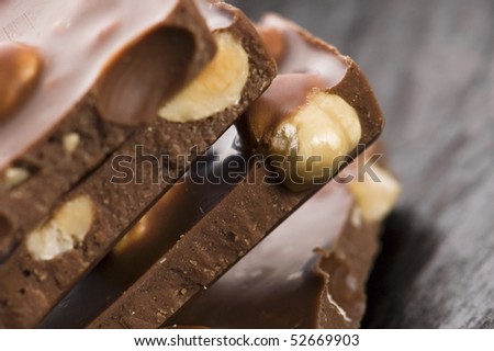Pile of broken chocolate with nuts