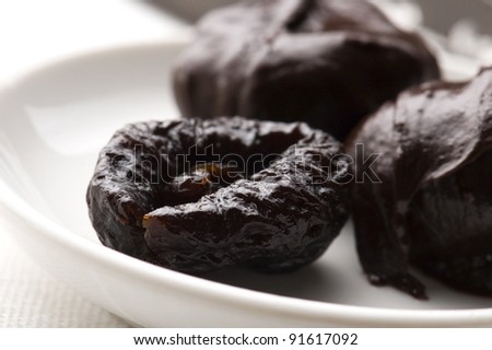 Dried plums in chocolate
