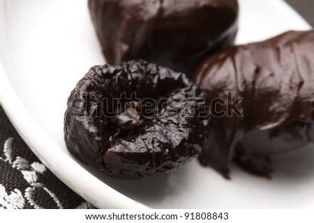 Dried plums in chocolate