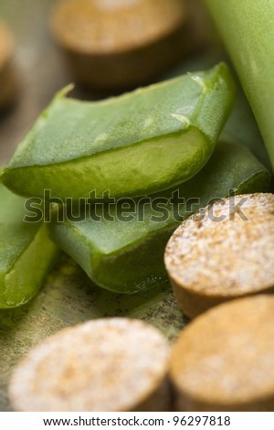 aloe vera plant with pills - herbal medicine