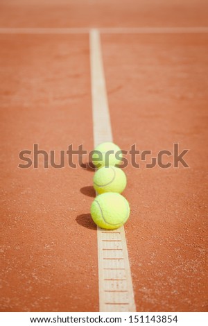 clay court with tennis balls